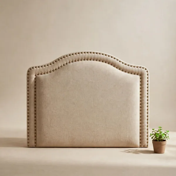 A curved studded headboard